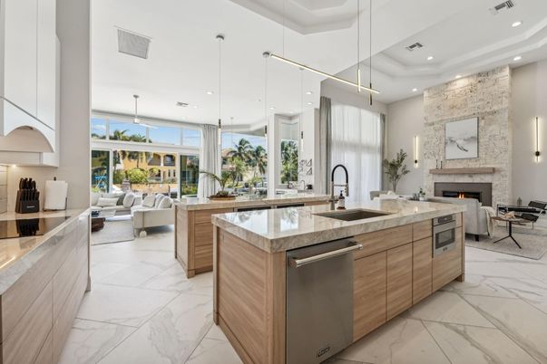 Fireplace, Interior, Kitchen, Living room, Marble, Pendant Lights, Recessed Lighting, Stainless Steel Appliances, Stone Walls