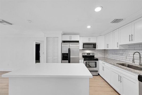 Interior, Kitchen, Recessed Lighting, Stainless Steel Appliances, Wood Texture Flooring