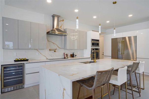Interior, Kitchen, Marble Walls, Pendant Lights, Recessed Lighting, Stainless Steel Appliances