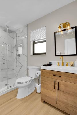 Bathroom, Glass Shower, Interior, Marble Walls, Wood Texture Flooring