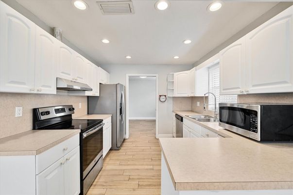 Interior, Kitchen, Recessed Lighting, Stainless Steel Appliances, Wood Texture Flooring
