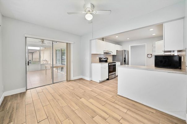 Interior, Kitchen, Recessed Lighting, Stainless Steel Appliances, Wood Texture Flooring