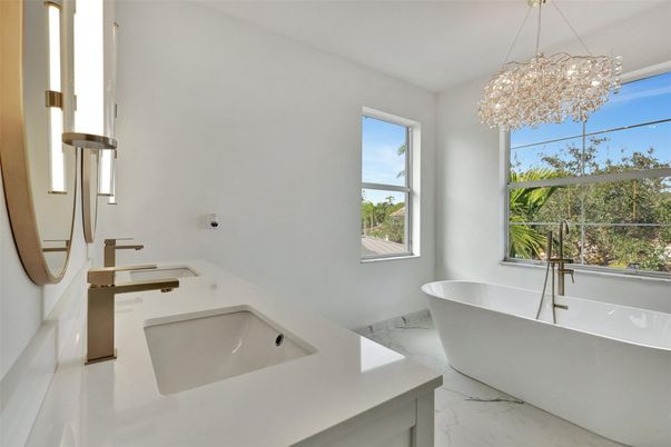 Bathroom, Chandelier, Dual Sink Vanities, Free Standing Baths, Interior, Marble, Pendant Lights