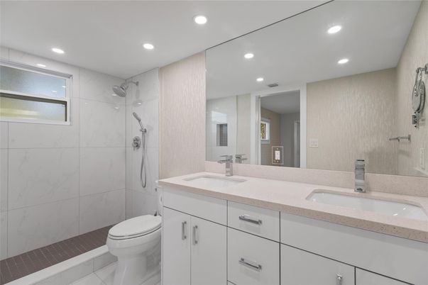 Bathroom, Dual Sink Vanities, Glass Shower, Interior, Marble Walls, Recessed Lighting
