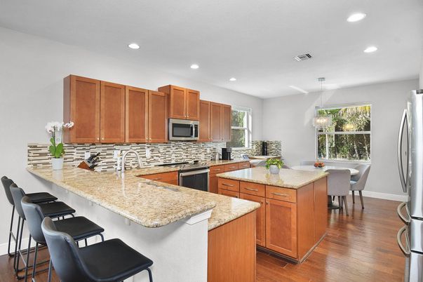 Chandelier, Dining room, Interior, Kitchen, Recessed Lighting, Stainless Steel Appliances, Wood Texture Flooring