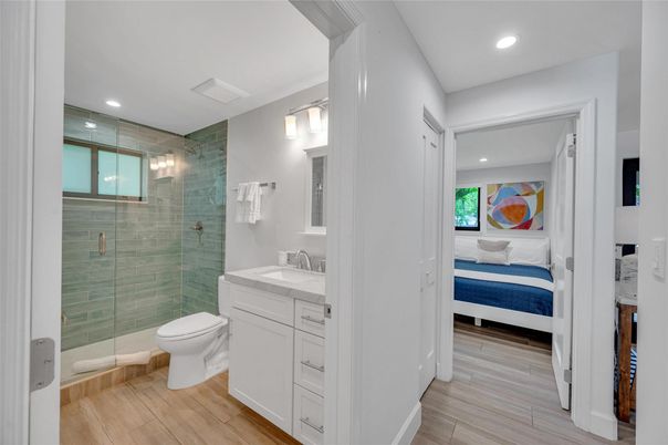 Bathroom, Bedroom, Glass Shower, Interior, Recessed Lighting, Wood Texture Flooring