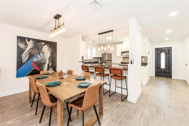 Dining room, Interior, Kitchen, Pendant Lights, Recessed Lighting, Stainless Steel Appliances, Wood Texture Flooring