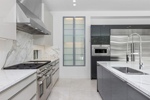 Interior, Kitchen, Marble Walls, Recessed Lighting, Stainless Steel Appliances
