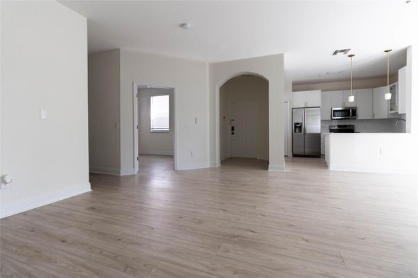 Empty room, Interior, Kitchen, Pendant Lights, Stainless Steel Appliances, Wood Texture Flooring