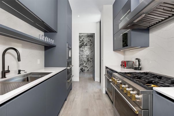 Interior, Kitchen, Marble Walls, Recessed Lighting, Stainless Steel Appliances, Wood Texture Flooring