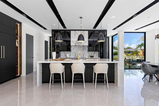 Interior, Kitchen, Marble Walls, Pendant Lights, Recessed Lighting, Stainless Steel Appliances