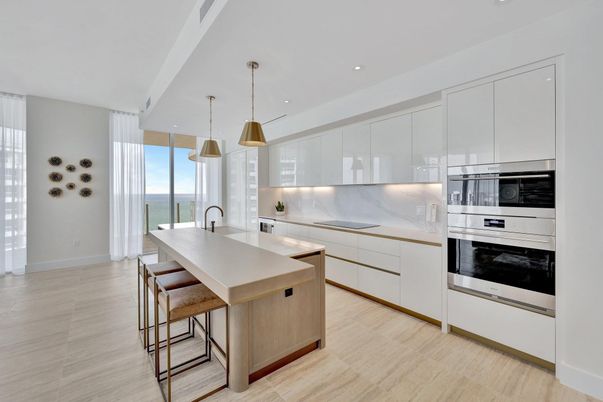 Interior, Kitchen, Marble Walls, Pendant Lights, Recessed Lighting, Stainless Steel Appliances, Water, Wood Texture Flooring