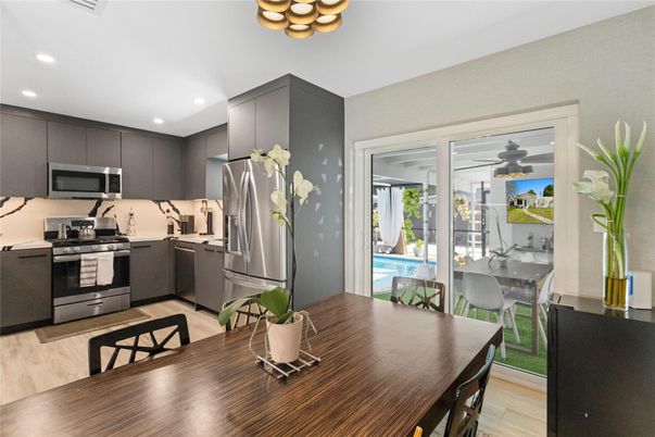 Dining room, Interior, Kitchen, Recessed Lighting, Stainless Steel Appliances, Wood Texture Flooring