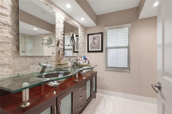 Bathroom, Dual Sink Vanities, Glass Shower, Interior, Recessed Lighting, Stone Walls