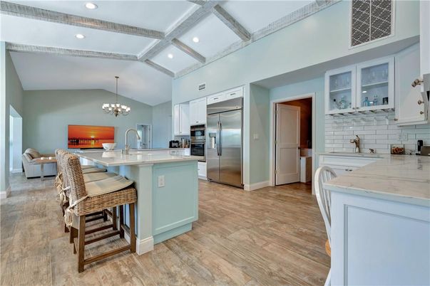Chandelier, Dining room, Interior, Kitchen, Recessed Lighting, Stainless Steel Appliances, Wooden Beams, Wood Texture Flooring