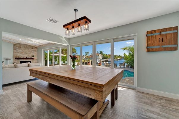 Dining room, Fireplace, Interior, Living room, Pendant Lights, Stone Walls, Wood Texture Flooring