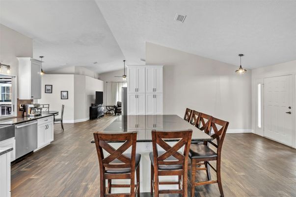 Dining room, Interior, Kitchen, Pendant Lights, Stainless Steel Appliances, Wood Texture Flooring