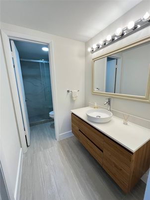 Bathroom, Dual Sink Vanities, Glass Shower, Interior, Wood Texture Flooring