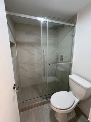 Bathroom, Glass Shower, Interior, Marble Walls, Wood Texture Flooring