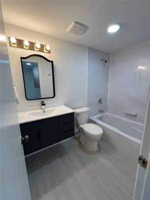 Bathroom, Dual Sink Vanities, Interior, Recessed Lighting, Wood Texture Flooring