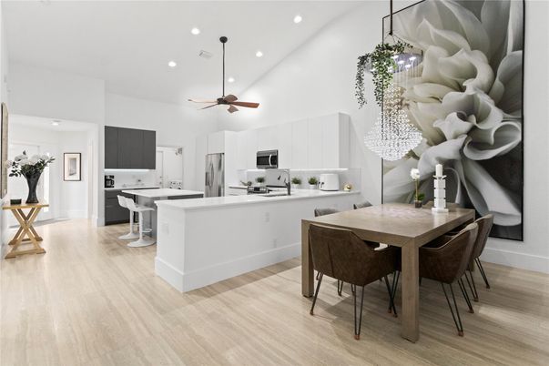 Dining room, Interior, Kitchen, Pendant Lights, Recessed Lighting, Stainless Steel Appliances, Wood Texture Flooring