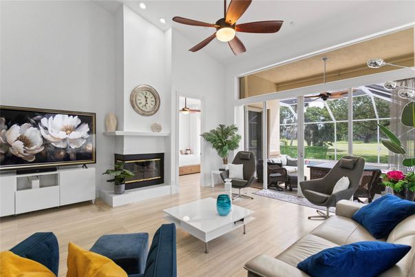 Fireplace, Interior, Living room, Recessed Lighting, Sun Room, Wood Texture Flooring
