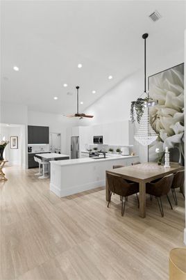 Dining room, Interior, Kitchen, Pendant Lights, Recessed Lighting, Stainless Steel Appliances, Wood Texture Flooring