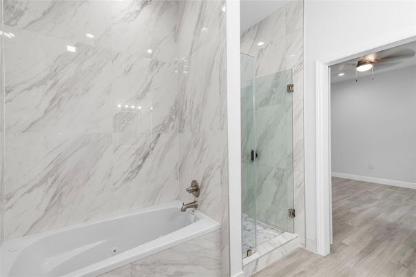 Bathroom, Glass Shower, Interior, Marble Walls, Recessed Lighting, Wood Texture Flooring