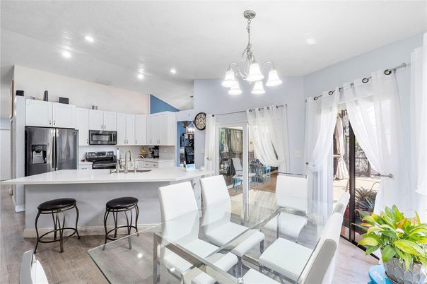 Chandelier, Dining room, Interior, Kitchen, Pendant Lights, Recessed Lighting, Stainless Steel Appliances