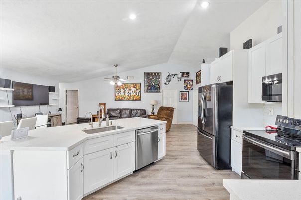 Dining room, Interior, Kitchen, Recessed Lighting, Stainless Steel Appliances, Wood Texture Flooring