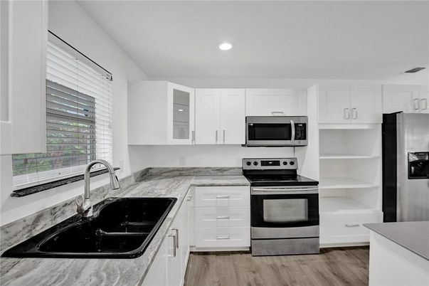 Interior, Kitchen, Recessed Lighting, Stainless Steel Appliances, Wood Texture Flooring