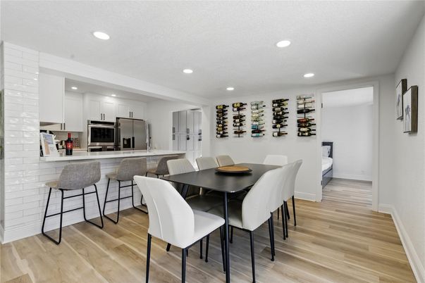 Dining room, Interior, Kitchen, Recessed Lighting, Stainless Steel Appliances, Wood Texture Flooring
