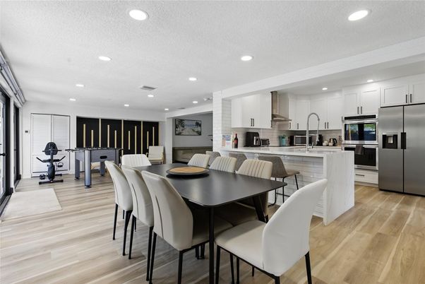 Dining room, Interior, Kitchen, Recessed Lighting, Stainless Steel Appliances, Wood Texture Flooring