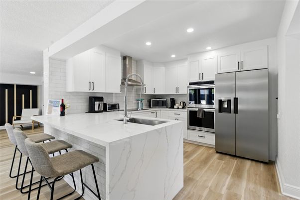 Interior, Kitchen, Recessed Lighting, Stainless Steel Appliances, Wood Texture Flooring
