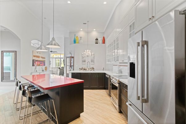Chandelier, Dining room, Interior, Kitchen, Pendant Lights, Recessed Lighting, Stainless Steel Appliances, Wood Texture Flooring