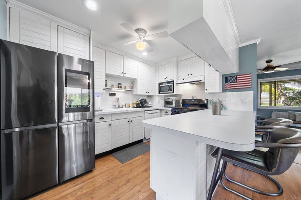 Interior, Kitchen, Recessed Lighting, Stainless Steel Appliances, Wood Texture Flooring
