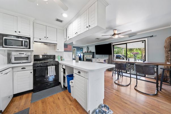 Dining room, Interior, Kitchen, Recessed Lighting, Stainless Steel Appliances, Wood Texture Flooring