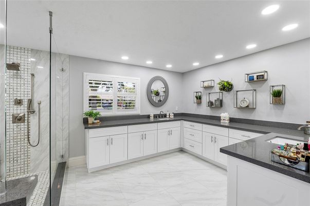 Bathroom, Dual Sink Vanities, Glass Shower, Interior, Marble, Recessed Lighting
