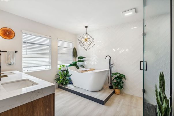 Bathroom, Dual Sink Vanities, Free Standing Baths, Glass Shower, Interior, Marble Walls, Pendant Lights, Wood Texture Flooring
