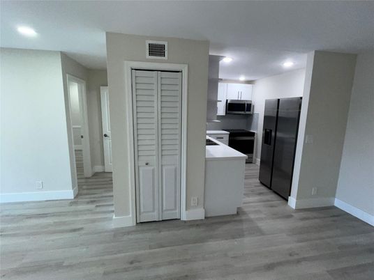 Interior, Kitchen, Recessed Lighting, Stainless Steel Appliances, Wood Texture Flooring