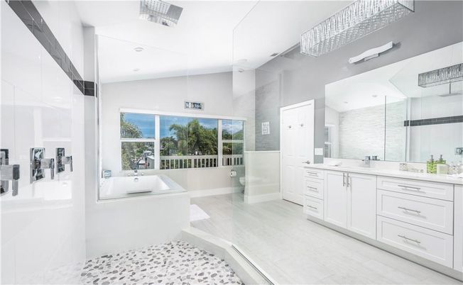 Bathroom, Dual Sink Vanities, Glass Shower, Interior, Recessed Lighting, Wood Texture Flooring