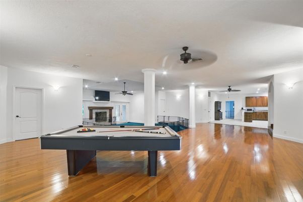 Billiard Table, Fireplace, Game Room, Interior, Recessed Lighting, Wood Texture Flooring