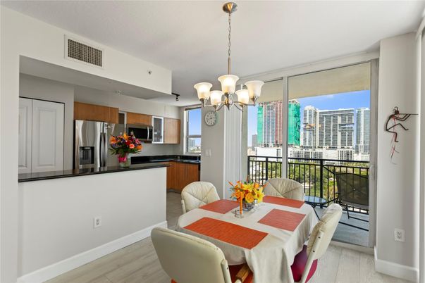 Chandelier, Dining room, Interior, Kitchen, Stainless Steel Appliances, Wood Texture Flooring