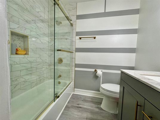 Bathroom, Glass Shower, Interior, Marble Walls, Wood Texture Flooring