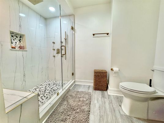 Bathroom, Glass Shower, Interior, Marble Walls, Recessed Lighting, Wood Texture Flooring