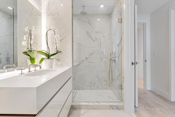 Bathroom, Dual Sink Vanities, Glass Shower, Interior, Marble, Marble Walls, Recessed Lighting