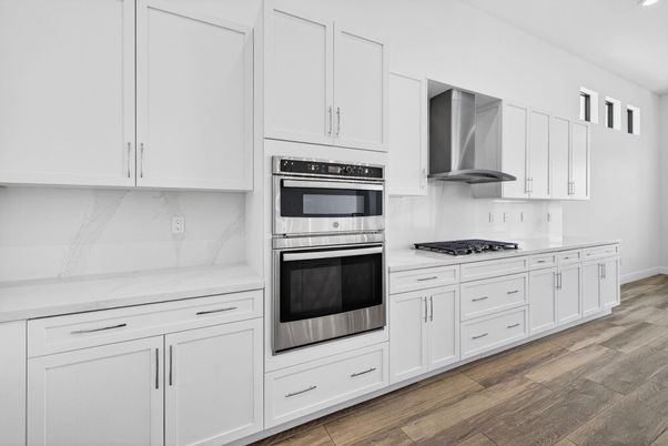 Interior, Kitchen, Marble Walls, Recessed Lighting, Stainless Steel Appliances, Wood Texture Flooring