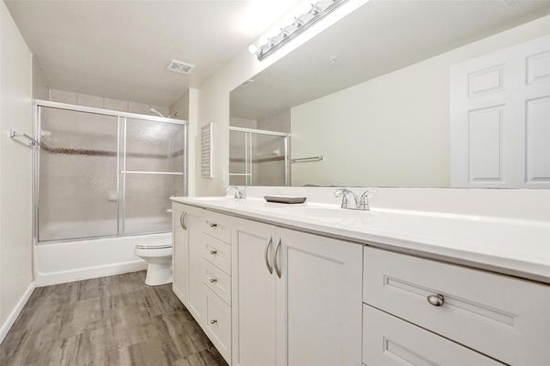 Bathroom, Dual Sink Vanities, Glass Shower, Interior, Wood Texture Flooring