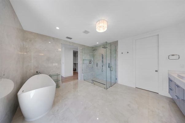 Bathroom, Dual Sink Vanities, Free Standing Baths, Glass Shower, Interior, Marble, Marble Walls, Recessed Lighting
