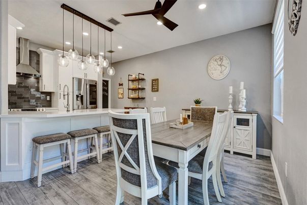Dining room, Interior, Kitchen, Pendant Lights, Recessed Lighting, Stainless Steel Appliances, Wood Texture Flooring